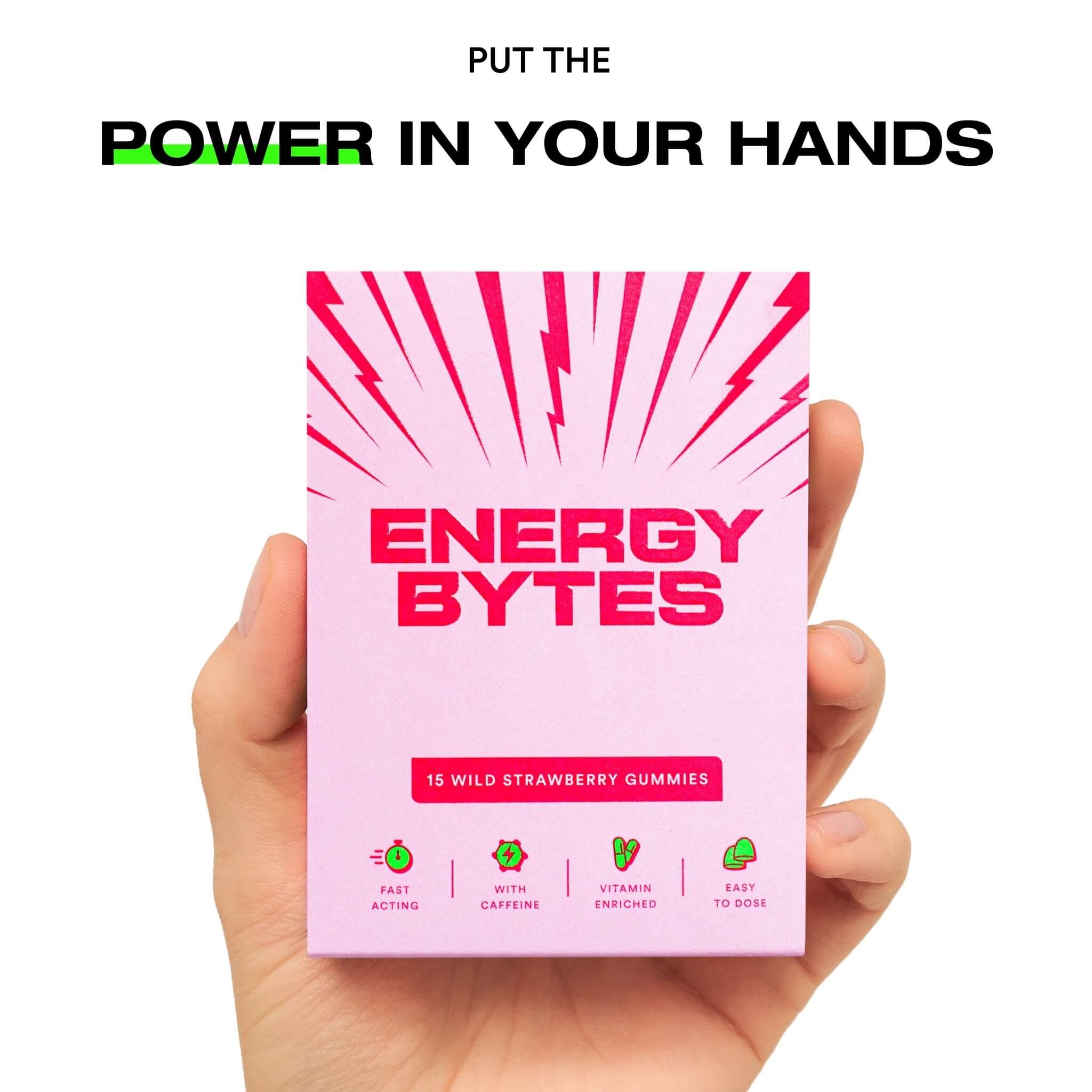 Hand holding a pack of Energy Bytes Wild Strawberry Gummies with text above reading 'PUT THE POWER IN YOUR HANDS'.