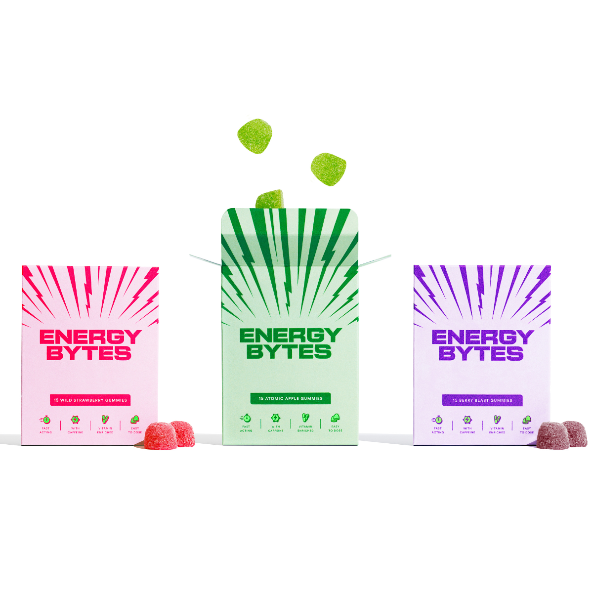 Three packs of Energy Bytes gummy in Wild Strawberry, Atomic Apple, and Berry Blast flavours, each with vibrant ray designs and floating gummies, highlight their fast-acting, caffeine, vitamin-enriched benefits.